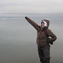 Student standing in front of Arctic Ocean.